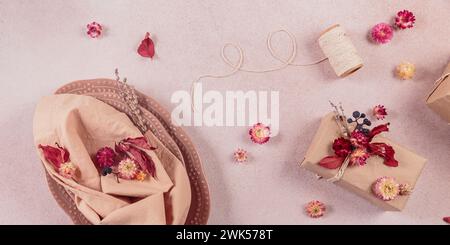 Process of decorating festive autumn table setting with dried flowers Stock Photo