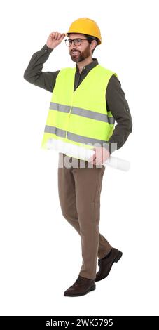 Architect in hard hat with draft walking on white background Stock Photo