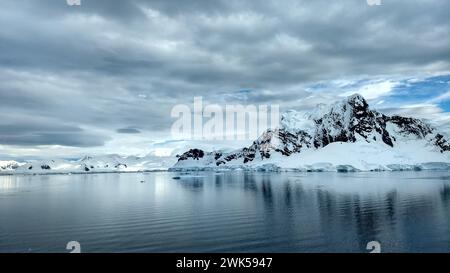 Mountains on Antarctica and icebergs floating on the water. Stock Photo