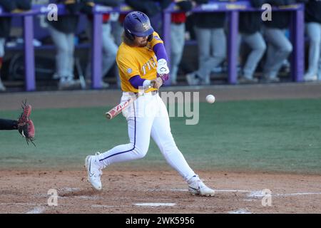 Baton Rouge, LA, USA. 18th Feb, 2024. LSU's Tommy White (47) delivers a hit during NCAA Baseball action between the VMI Keydets and the LSU Tigers at Alex Box Stadium, Skip Bertman Field in Baton Rouge, LA. Jonathan Mailhes/CSM/Alamy Live News Stock Photo