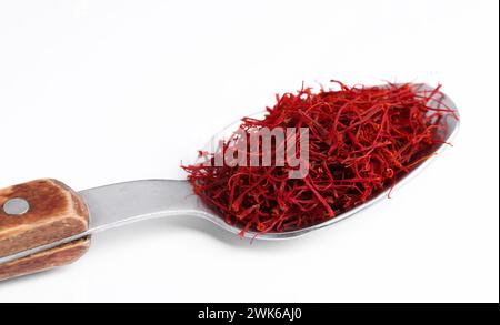 Aromatic saffron in spoon isolated on white Stock Photo