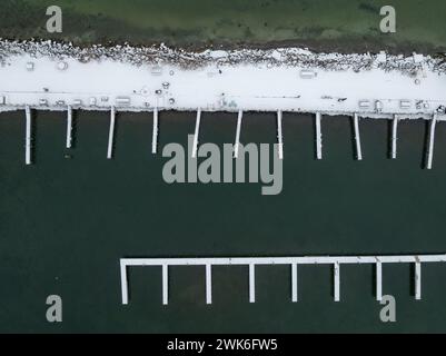 Winter afternoon aerial images of docks in Lansing, NY, on the east side of Cayuga Lake. Stock Photo