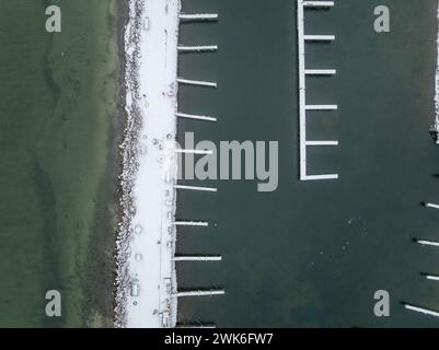 Winter afternoon aerial images of docks in Lansing, NY, on the east side of Cayuga Lake. Stock Photo