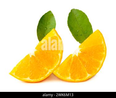 Front view of fresh shogun or tangerine mandarin orange slices or quarters and green leaves is isolated on white background with clipping path. Stock Photo