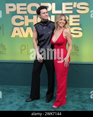 Los Angeles, USA. 18th Feb, 2024. (L-R) Darren Barnet and Sydney Sweeney walking on the red carpet at the People's Choice Awards held at the The Barker Hangar in Santa Monica, CA on Sunday, ?February 18, 2024. (Photo By Sthanlee B. Mirador/Sipa USA) Credit: Sipa USA/Alamy Live News Stock Photo