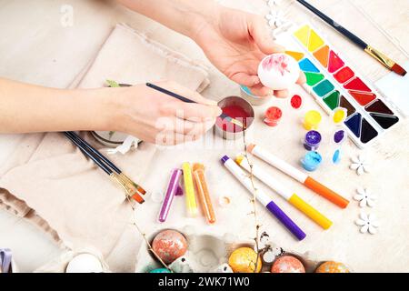 DIY Easter egg painting. Holidays and creativity. Tradition concept. Stock Photo