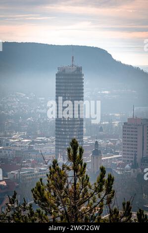View of the city of Jena with the Jentower (Uniturm) and the Kernberge in the background, in low fog in the morning, Jena, Thuringia, Germany Stock Photo