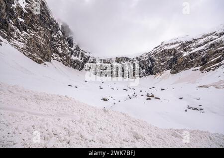 Remains of snow avalanches in a white Cirque de Gavarnie in late winter (Gavarnie, Hautes-Pyrénées, Occitanie, France, Pyrenees) Stock Photo