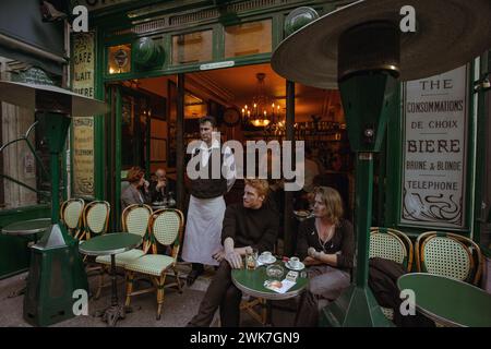 FRANCE / IIe-de-France/Paris/ Le Marais/ These friends know that the best spot to view Paris and Parisians is a well-placed outdoor café. Stock Photo