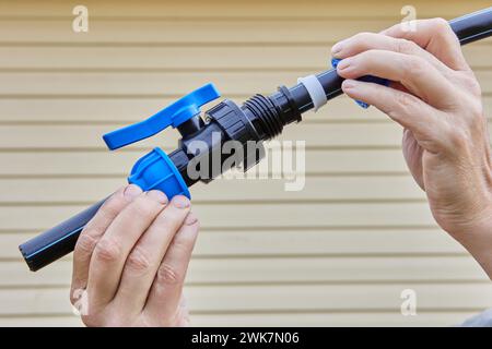 Valve fitting with compression latch for HDPE pipes is used when installing external pipelines for drinking and irrigation water and is added to water Stock Photo