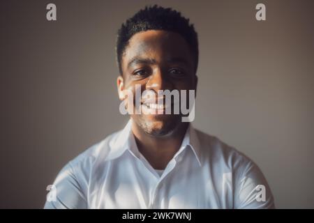 Portrait of happy man who is smiling and looking at camera. Stock Photo