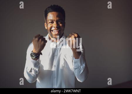 Portrait of happy and successful businessman who is smiling and looking at camera. Stock Photo