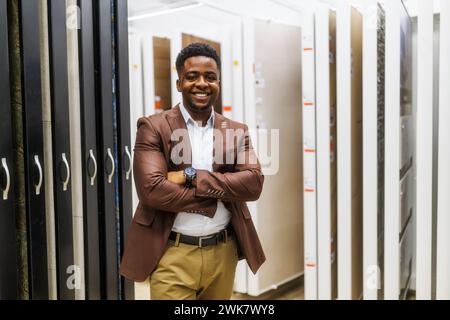 Portrait of salesperson in bathroom store. Happy man works in bath store. Sales occupation. Stock Photo