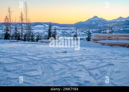 Tyre tracks in the snow on a mountain car park Stock Photo