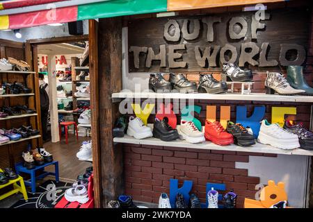 Harajuku ward of Tokyo, famous trendy street Takeshita Dori and Out of the World shoe boot fashion store for footwear, Japan,2023 Stock Photo