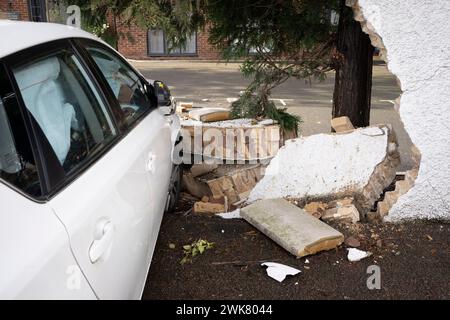 The aftermath of a crashed car and the impact on the wall of a residential property near Ickenham, on 18th February 2024, in London, England. Stock Photo