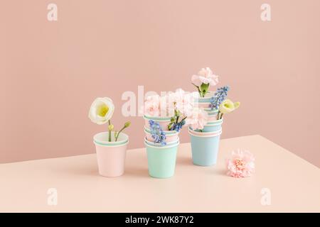 Eco-friendly concept. Stack Of Paper Disposable Cups with flowers Stock Photo