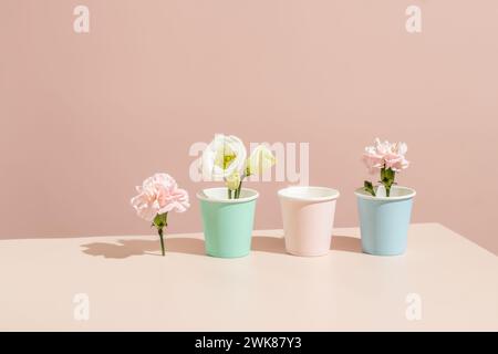 Eco-friendly paper mockup coffee cups on a beige background. Stock Photo