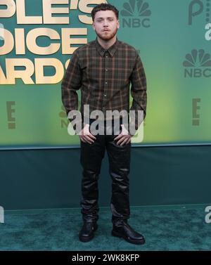 Los Angeles, USA. 18th Feb, 2024. Bazzi walking on the red carpet at the People's Choice Awards held at the The Barker Hangar in Santa Monica, CA on Sunday, ?February 18, 2024. (Photo By Sthanlee B. Mirador/Sipa USA) Credit: Sipa USA/Alamy Live News Stock Photo