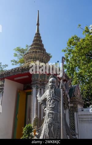 A Chinese guardian statue at Wat Pho, the Temple of the Reclining Buddha in Bangkok, Thailand. Stock Photo