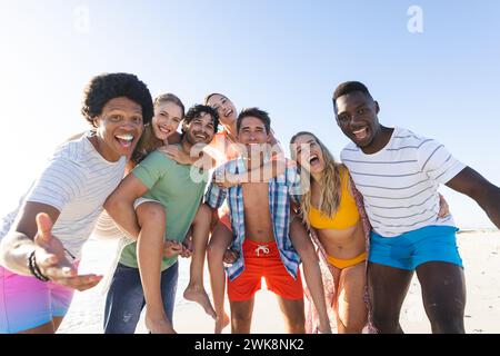 Diverse group of friends enjoying a day at the beach Stock Photo