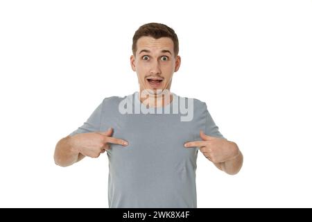 happy guy looking pointing at himself on white studio background Stock Photo