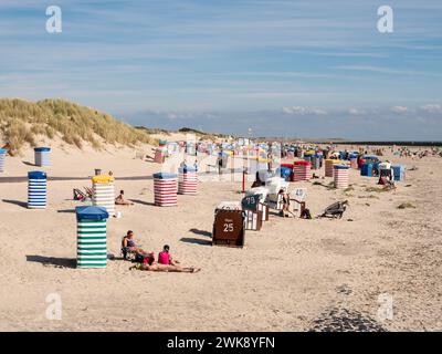 People with beach chairs and tents on south beach of East Frisian island Borkum, Lower Saxony, Germany Stock Photo