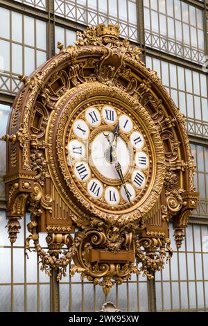 Paris, France - July 5, 2018: Golden clock of the museum D'Orsay. The Musee d'Orsay is a museum in Paris, on the left bank of the Seine. Golden colore Stock Photo