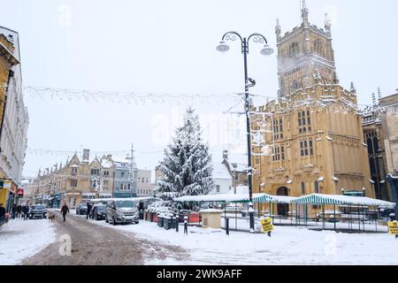 Heavy snow has fallen in the Cirencester in then Cotswolds. People are seen  out walking and playing in Cirencester park adn the Abbey grounds. Stock Photo