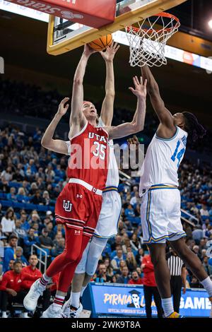 UCLA Bruins forward Kenneth Nwuba (14) challenges Utah Utes center Branden Carlson (35) at the rim during a men’s NCAA basketball game, Sunday, Februa Stock Photo