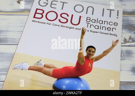 Viersen, Germany - January 9. 2024: Book with instructions for home training sports equipment Bosu balance ball trainer, Colleen Craig Stock Photo