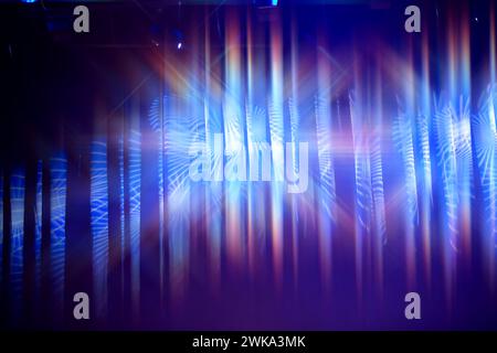 Blue theater curtain background with stage multicolored lighting. Stock Photo