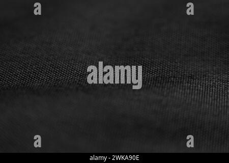Black rough canvas texture. Abstract woven fiber closeup Stock Photo