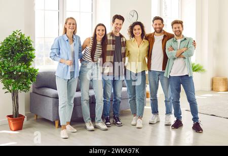 Portrait of group of happy and carefree best friends having fun together at home. Stock Photo