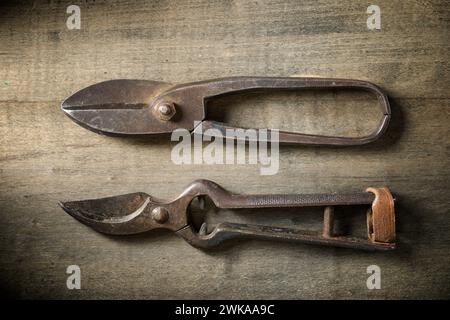 Close up of a pair of old disused pliers on a work bench. Stock Photo
