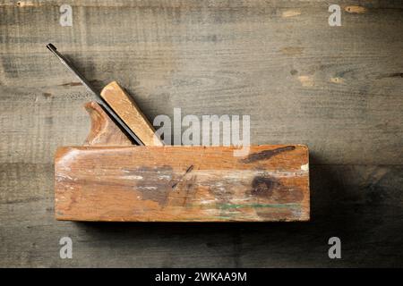 Close up of an old disused carpenter's plane on a work bench. Stock Photo