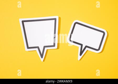 Two Blank Speech Bubble isolated on yellow background. Mock up template Stock Photo