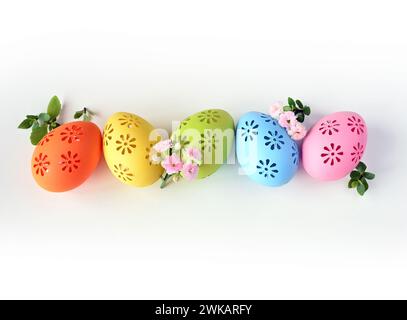Collection of stylish colors eggs with flowers for Easter celebration on white background. Holiday concept. Stock Photo