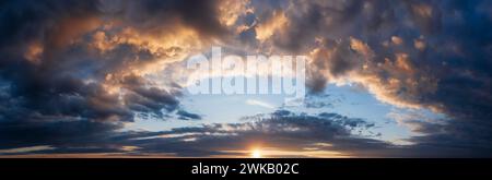 Beautiful panorama of cloudy sunset sky. Stock Photo