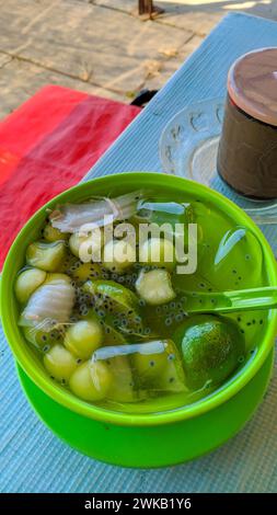 fresh ice in a bowl with lime juice, coconut and melon slices. Stock Photo