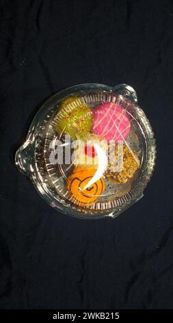 Close up of donuts with various color variants and toppings Stock Photo ...