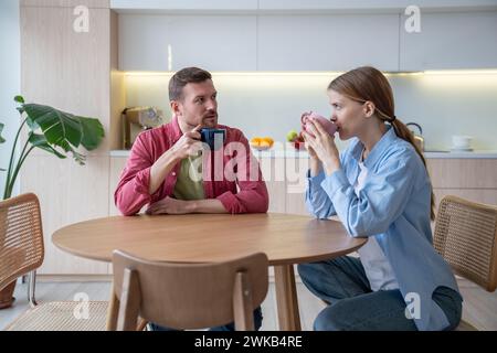Married communication. Loving family couple spending pastime talking together on weekends at home. Stock Photo