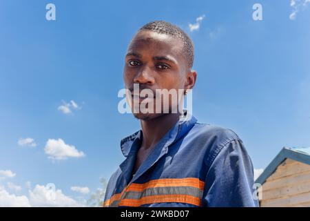 portrait of african american carpenter worker at his workplace doing wendy houses on the side of the road Stock Photo