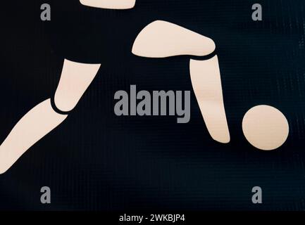 Headless body runs up to a soccer ball Stock Photo