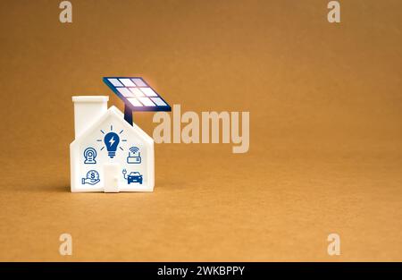 Sustainability at Home concept. 3d Solar panels being installed on white toy house with electrical appliance icons on brown recycle paper background, Stock Photo