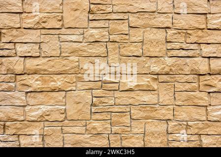 Artificial stone wall, imitation natural stone made of synthetic material, plastic, pattern, structure, background, wallpaper Stock Photo