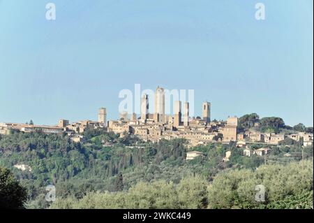 Town view, town scape, cityscape of San Gimignano in autumn, gender towers, countryside, in fall, fields of olive trees, wineyards, Tuscany, Italy Stock Photo