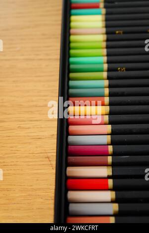 A collection of vibrant colored pencils in a box Stock Photo