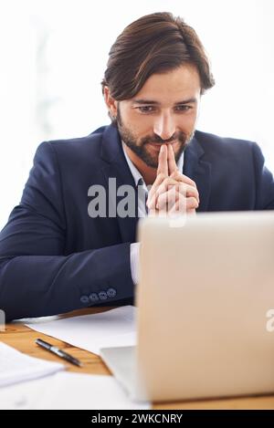 Lawyer, man and office with laptop and idea at work, smile and paperwork with information for court. Law firm, small business and document with Stock Photo