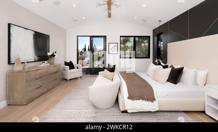 A modern, cozy, spacious bedroom with a king-size bed Stock Photo